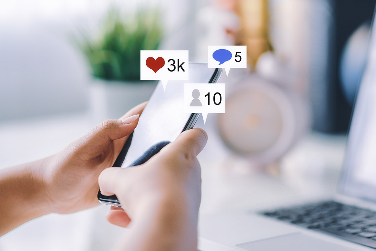 Hand using smart phone with Social media concept